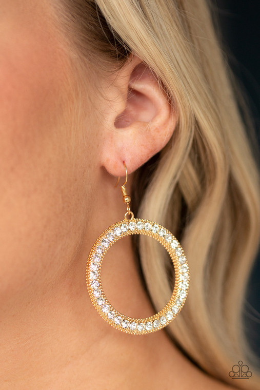 Encrusted in a glittery ring of white rhinestones, a studded gold hoop swings from the ear for a dramatic look. Earring attaches to a standard fishhook fitting.

Sold as one pair of earrings.