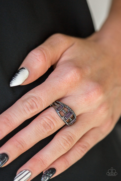 Three purple emerald-cut rhinestones are encrusted along three gunmetal bands radiating with smooth surfaces and sections of glittery hematite rhinestones for an edgy fashion. Features a stretchy band for a flexible fit.

Sold as one individual ring.