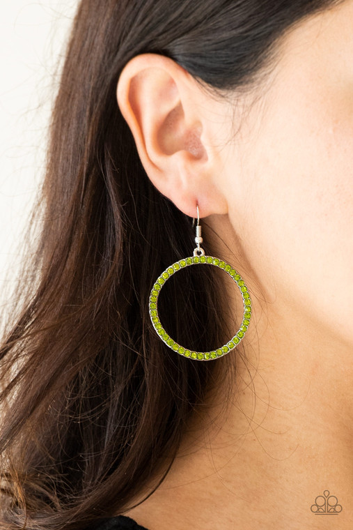Glittery green rhinestones are encrusted along the front of a warped silver hoop for a refined look. Earring attaches to a standard fishhook fitting.

Sold as one pair of earrings.