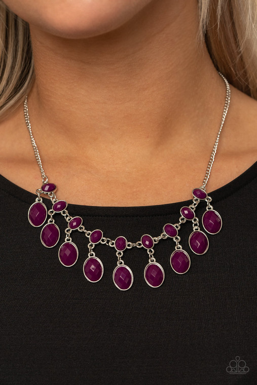 A colorful collection of oversized Magenta Purple oval beaded frames swing from the bottom of smaller beaded frames, delicately linking into a vintage inspired fringe below the collar. Features an adjustable clasp closure.

Sold as one individual necklace. Includes one pair of matching earrings.