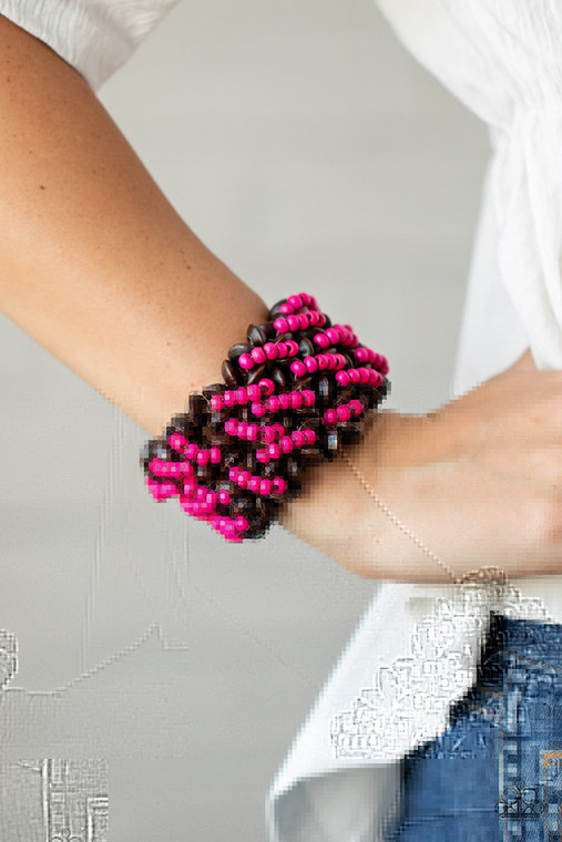 A collection of dainty pink wooden beads and brown wooden discs are threaded along knotted stretchy bands, creating a tropical floral pattern around the wrist.

Sold as one individual bracelet.