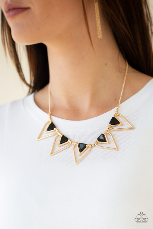Infused with shiny black beading, glistening gold triangular frames join below the collar, creating a fierce geometric fringe. Features an adjustable clasp closure.

Sold as one individual necklace. Includes one pair of matching earrings.