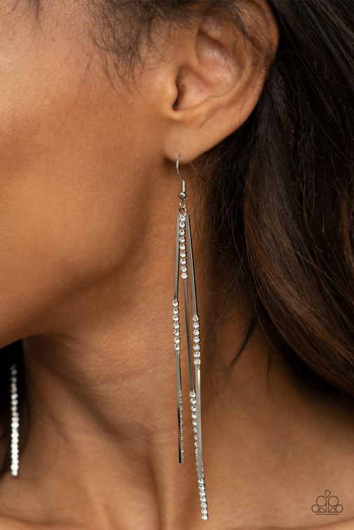 Sections of glassy white rhinestones attach to dainty silver rectangular rods, creating a statement-making tassel. Earring attaches to a standard fishhook fitting.

Sold as one pair of earrings.