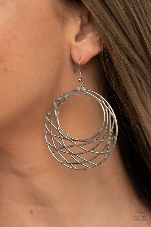 Shimmery silver bars crisscross and overlap along the bottom of a circular frame, creating a crescent-like hoop. Earring attaches to a standard fishhook fitting.

Sold as one pair of earrings.