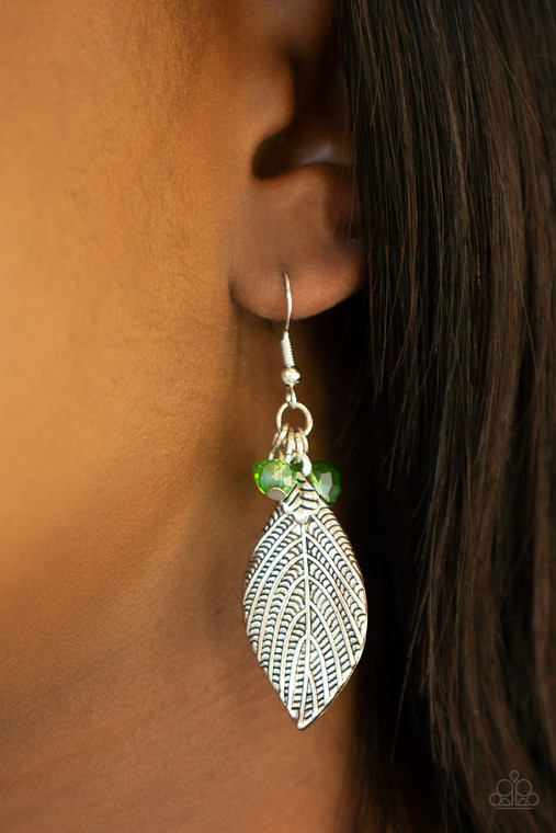 A lifelike silver leaf swings from a cluster of glittery green crystal-like beads, creating a spring inspired lure. Earring attaches to a standard fishhook fitting.

Sold as one pair of earrings.