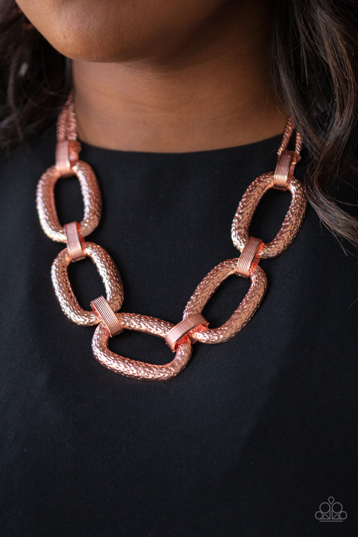 Delicately hammered in blinding shimmer, oversized shiny copper chain links and textured fittings connect below the collar. Suspended from strands of shiny copper chains, the bold links catch and reflect the light for a statement-making finish. Features an adjustable clasp closure.

Sold as one individual necklace. Includes one pair of matching earrings.