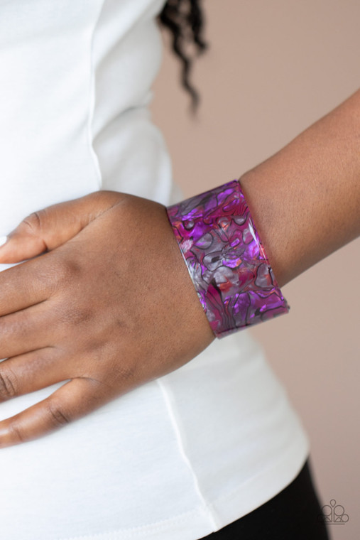 Featuring a retro watercolor pattern, a thick purple acrylic cuff curls around the wrist for an out-of-this-world colorful look.

Sold as one individual bracelet.