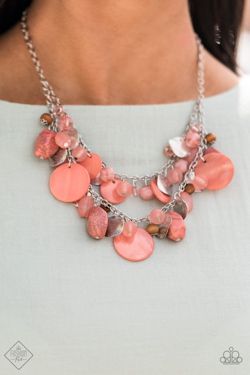 What better way to say "hello spring" than with this vibrant stunner? Double the fun with two layers of beads, baubles, stone, and wood in varying tones and finishes in the Pantone® of Burnt Coral, intermixed with sparkling, wavy silver discs gently swaying from a silver chain. Features an adjustable clasp closure.

Sold as one individual necklace. Includes one pair of matching earrings.