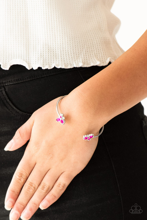 Varying in shape, glittery pink and white rhinestones join at both ends of a dainty silver cuff, creating refined fittings.

Sold as one individual bracelet.