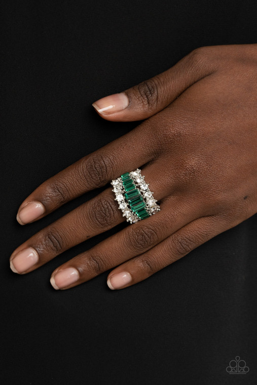 Flanked between two sparkly rows of stunning white rhinestones, a row of glittery green emerald cut rhinestones gradually increase in size at the center for a dramatically stacked look across the finger. Features a stretchy band for a flexible fit.

Sold as one individual ring.