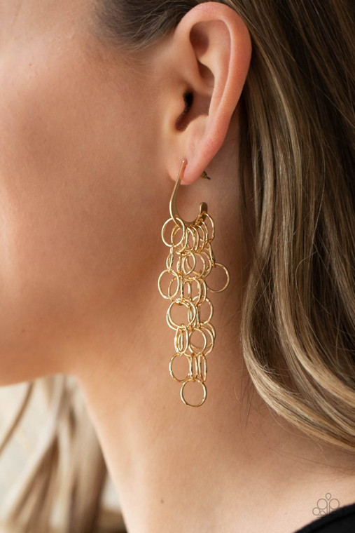 Strands of shiny gold links cascade from the bottom of a dainty hook shaped hoop, creating a rebellious fringe. Hoop measures approximately 1/2" in diameter. Earring attaches to a standard post fitting.

Sold as one pair of hoop earrings.