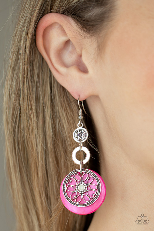 Reminiscent of an eclipse, an airy silver ring radiating with ornate petals, sways in front of a pink shell-like disc. Silver rings in graduating sizes cascade from the top for a whimsically nautical look. Earring attaches to a standard fishhook fitting.

Sold as one pair of earrings.