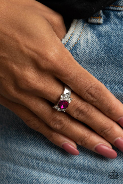 Trios of glassy white rhinestones flank an oversized pink rhinestone, creating a sparkly centerpiece atop a dainty silver band. Features a dainty stretchy band for a flexible fit.

Sold as one individual ring.