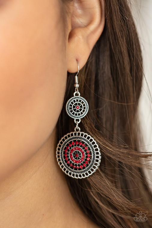 The centers of silver wheel-like frames are bedazzled in fiery red rhinestones, creating a glamorous display as the frames link into a sparkly lure. Earring attaches to a standard fishhook fitting.

Sold as one pair of earrings.