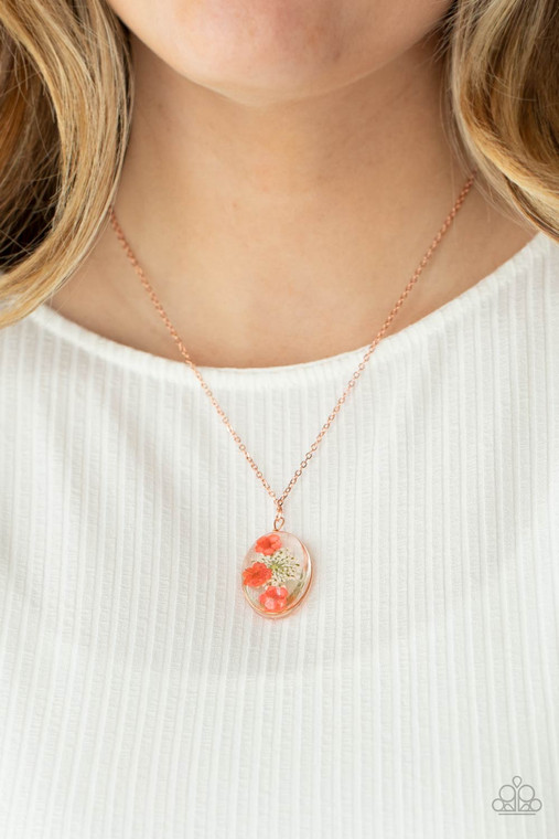 A romantic bouquet of bright springtime flowers, encased in an acrylic globe, falls gently below the collar for a sweet forever memento. Features an adjustable clasp closure.

Sold as one individual necklace. Includes one pair of matching earrings.