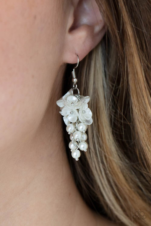 A cluster of pearly white floral frames and dainty white pearls trickle from a silver chain, creating a romantic chandelier. Earring attaches to a standard fishhook fitting.

Sold as one pair of earrings.