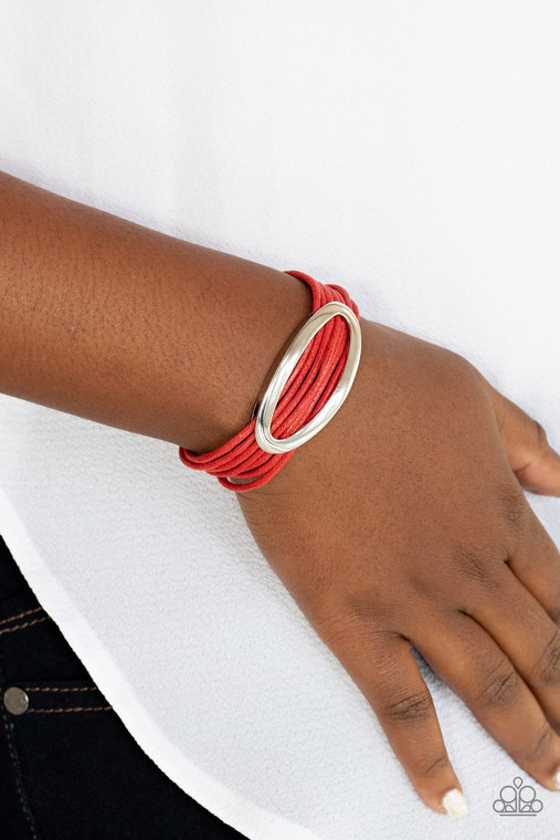An oval silver fitting glides along strands of red cording, creating colorful layers around the wrist. Features a magnetic closure.

Sold as one individual bracelet.
