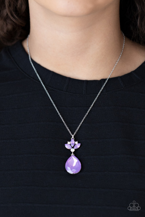 Featuring a dewy iridescence, an oversized Amethyst Orchid teardrop gem swings from a crown of white rhinestones and marquise cut Amethyst Orchid gems, creating a regal pendant below the collar. Features an adjustable clasp closure.

Sold as one individual necklace. Includes one pair of matching earrings.