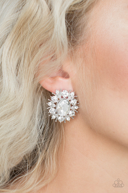Varying in size, glittery white rhinestones and ornate silver accents burst from a dramatic white gem center for a stellar look. Earring attaches to a standard post fitting.

Sold as one pair of post earrings.