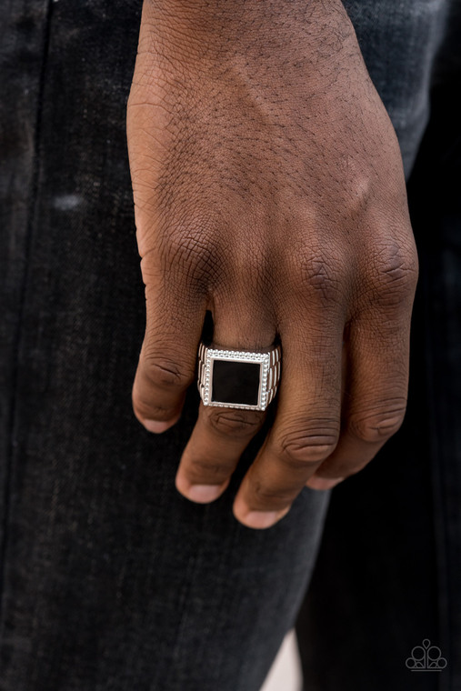 Painted in a shiny finish, a bold black square is bordered by silver studded detail atop a textured silver band for a sophisticated look. Features a stretchy band for a flexible fit.

Sold as one individual ring.