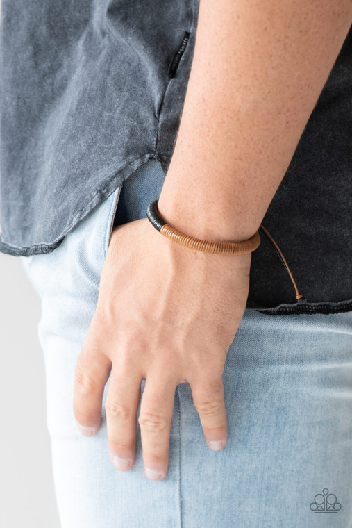 Earthy brown cording fades into shiny black cording across the wrist for a seasonal look. Features an adjustable sliding knot closure. 

Sold as one individual bracelet.