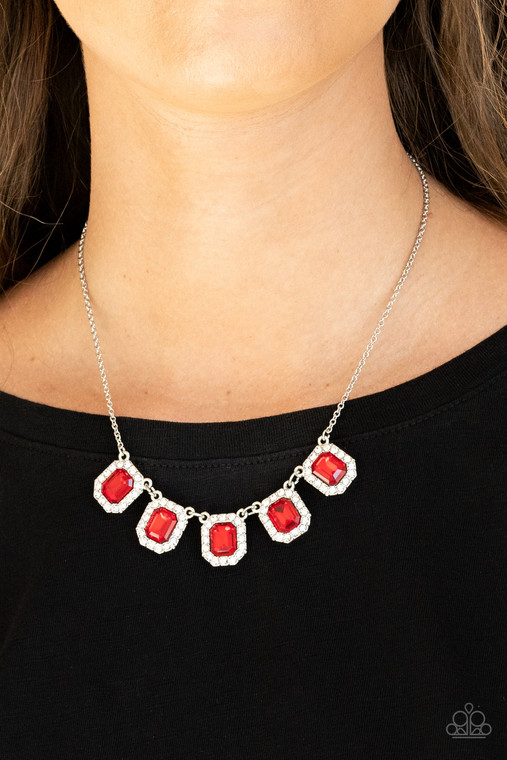 Bordered in glassy white rhinestones, fiery red emerald style rhinestone encrusted frames gorgeously link below the collar for a timeless fashion. Features an adjustable clasp closure.

Sold as one individual necklace. Includes one pair of matching earrings.