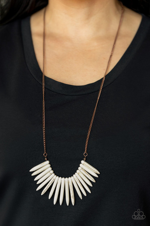 A daring fringe of white stone spikes in gradually decreasing sizes flare out below the collar for an exotic and edgy effect. Features an adjustable clasp closure.

Sold as one individual necklace. Includes one pair of matching earrings.