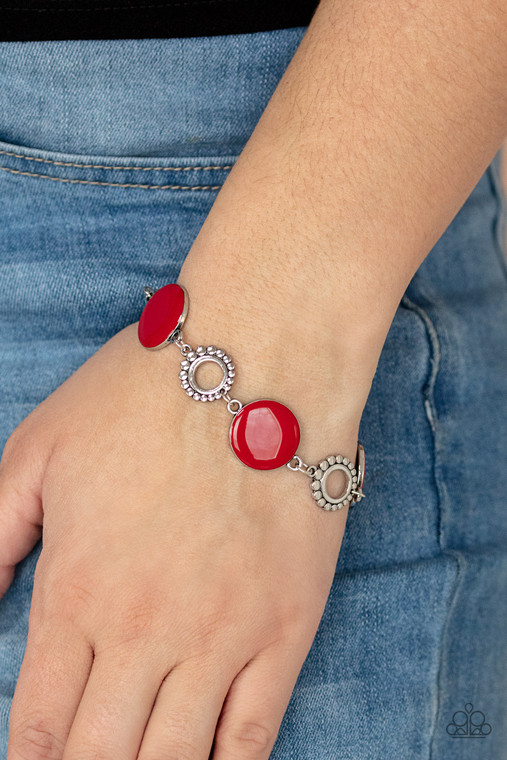 Featuring shiny red accents, studded silver circles and shimmery silver floral accents link around the wrist for a colorful display. Features an adjustable clasp closure.

Sold as one individual bracelet.