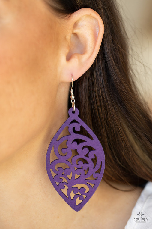 Painted in a vibrant purple finish, a floral motif permeates an airy oval wooden frame creating a tropical-inspired lure. Earring attaches to a standard fishhook fitting.

Sold as one pair of earrings.