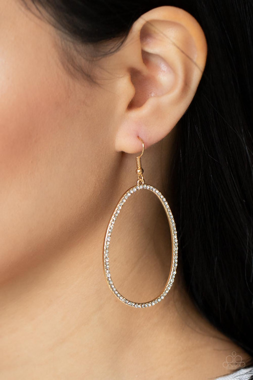 Dotted in dainty white rhinestones, an asymmetrical oval gold frame swings from the ear for a sassy look. Earring attaches to a standard fishhook fitting.

Sold as one pair of earrings.