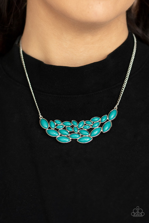 Encased in sleek silver frames, a collection of marquise shaped blue beads delicately coalesce into a leafy pendant below the collar for a whimsical pop of color. Features an adjustable clasp closure.

Sold as one individual necklace. Includes one pair of matching earrings