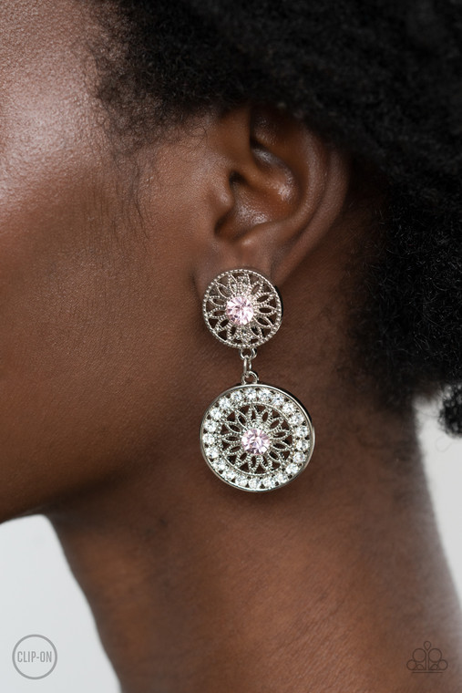 Dotted with glittery pink rhinestone centers, shimmery silver floral frames link into a whimsical lure. The lower frame is bordered in glassy white rhinestones for a timeless finish. Earring attaches to a standard clip-on fitting.

Sold as one pair of clip-on earrings.