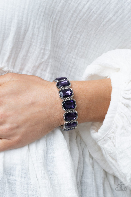 Oversized emerald style purple gems are encased in antiqued studded frames that are threaded along stretchy bands around the wrist, creating a smoldering centerpiece.

Sold as one individual bracelet.