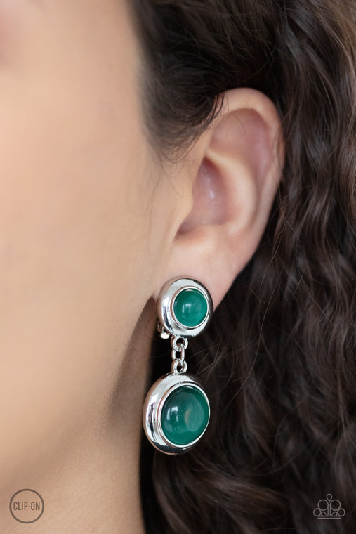 Encased in sleek silver fittings, two green cat's eye stones link into a whimsical lure. Earring attaches to a standard clip-on fitting.

Sold as one pair of clip-on earrings.