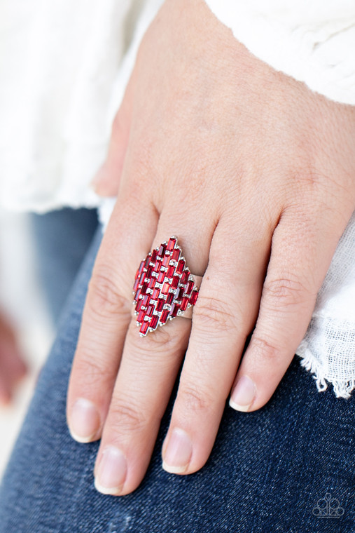 Fiery red emerald cut rhinestones are encrusted across the front of a studded silver frame, creating a sparkly honeycomb shaped centerpiece. Features a stretchy band for a flexible fit.

Sold as one individual ring.