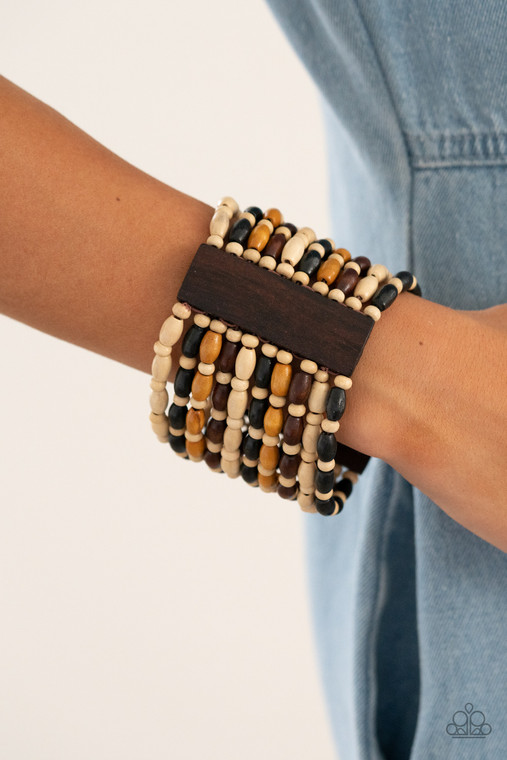 Held together with rectangular wooden frames, an earthy collection of white wooden beads and black, brown, and tan oval wooden beads are threaded along stretchy bands around the wrist for a bold beach inspired fashion.

Sold as one individual bracelet.