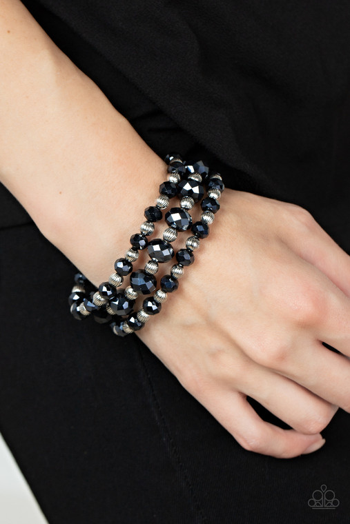 Varying in size, and explosion of metallic blue crystal-like gems and ornate silver beads are threaded along stretchy bands around the wrist for a glamorous fashion.

Sold as one set of three bracelets.