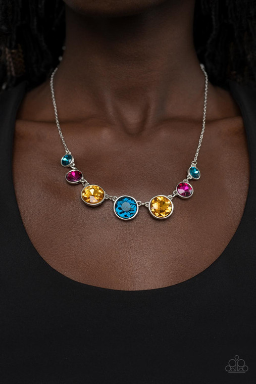 Encased in shiny silver frames, a glitzy collection of blue, yellow, and pink rhinestones gradually increase in size as they link below the collar for a flawless finish. Features an adjustable clasp closure.

Sold as one individual necklace. Includes one pair of matching earrings.