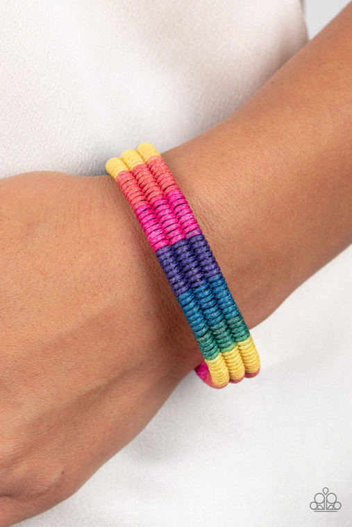 Colorful sections of pink, red, yellow, green, blue, and purple cords ornately wrap and weave around three black bands, coalescing into a radiant rainbow around the wrist. Features an adjustable sliding knot closure.

Sold as one individual bracelet.
