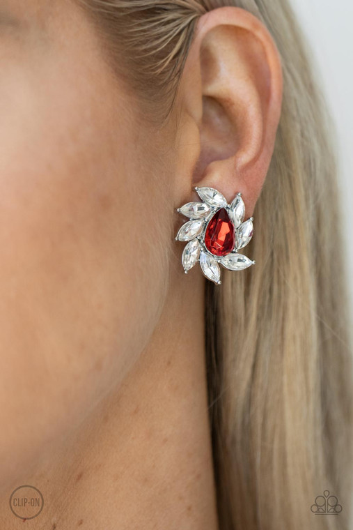 A red faceted teardrop gem is encompassed by a radiating frame of sparkling white marquise rhinestones set in silver pronged fittings creating a dramatically vintage finish. Earring attaches to a standard clip-on fitting.

Sold as one pair of clip-on earrings.