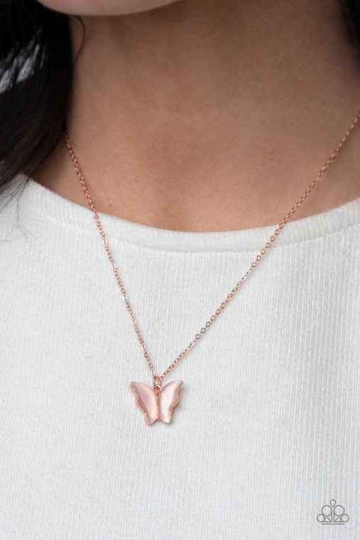 Infused with glistening cat's eye stone wings, a shiny copper butterfly pendant swings from a dainty shiny copper chain below the collar for a whimsy flair. Features an adjustable clasp closure.

Sold as one individual necklace. Includes one pair of matching earrings.