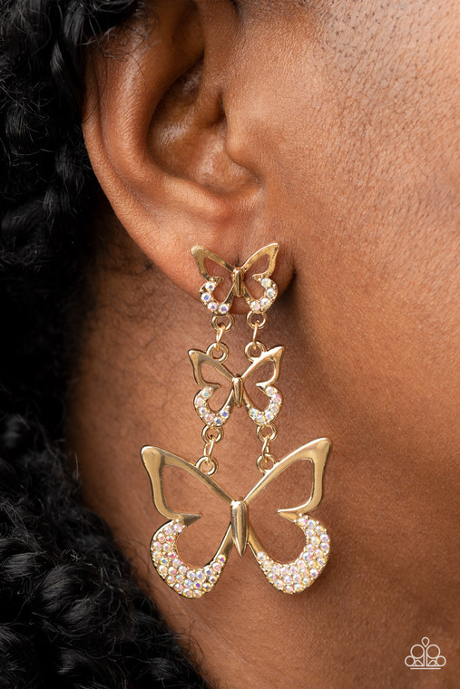 An airy trio of gold butterflies gradually increase in size as they link into a whimsical lure. The bottom of each butterfly has been dipped in iridescent rhinestones, adding a glitzy finish to the fluttering centerpiece. Earring attaches to a standard fishhook fitting.

Sold as one pair of post earrings.