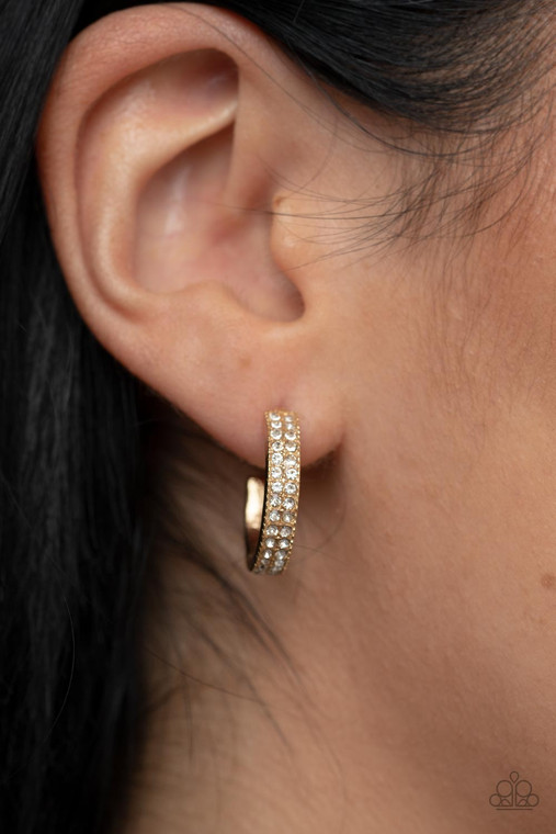 Two rows of glassy white rhinestones encrust the front of a dainty gold hoop, resulting in a timeless twinkle. Earring attaches to a standard post fitting. Hoop measures approximately 3/4" in diameter.

Sold as one pair of hoop earrings.