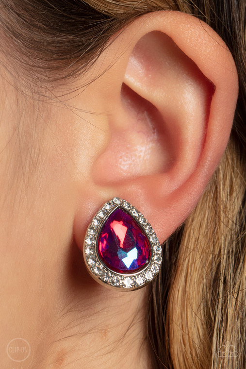 Featuring a flashy UV finish, a faceted pink teardrop gem is pressed into a silver frame bordered with glittery white rhinestones for a glamorous finish. Earring attaches to a standard clip-on fitting.

Sold as one pair of clip-on earrings.