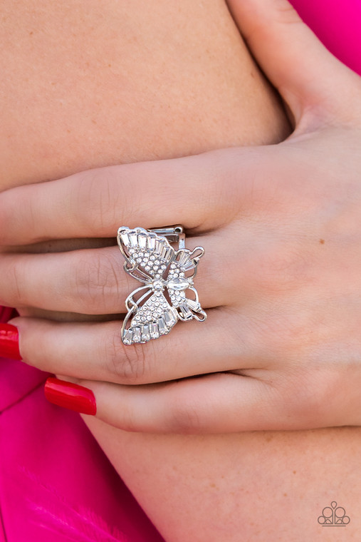 Sparkling with round, teardrop, and emerald cut white rhinestones, a silver butterfly fearlessly flutters atop the finger for a statement-making finish. Features a stretchy band for a flexible fit.

Sold as one individual ring.