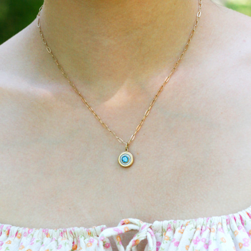 14kt Gold Blue Topaz En Soleil Charm