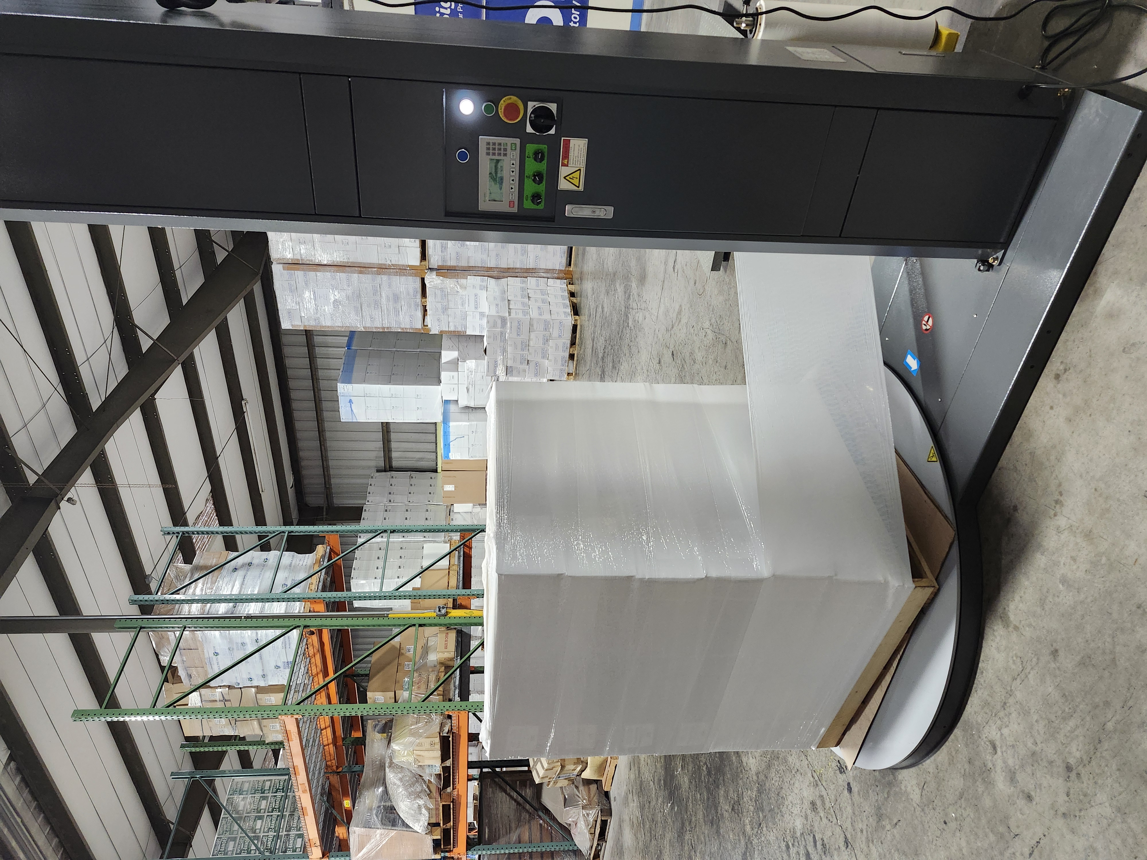 Wrapping a Dark Pallet with Opaque White Machine Film