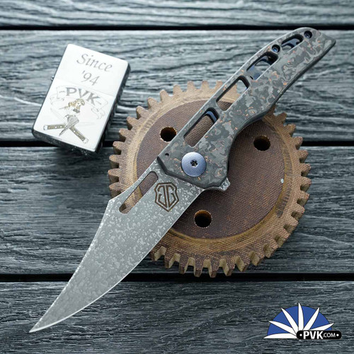 John Gray Slitter V2, Dark Rain Magnacut Bowie Blade, Copper Flake Carbon Fiber Scale And Blue/ Bronze Titanium Clip And FrameLock Lockside W/ Blue HW
