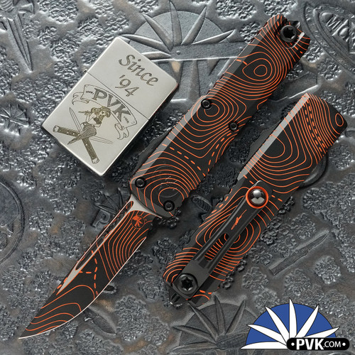 Microtech UTX-85 Gen 4 S/E 12314-1TPBKORCS, Topographic Black/Orange UV-Reactive Handles,  Black/Orange Topographic Blade
