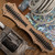 BURN Custom OTF Vengeance D/A OTF Hand Ground Double Edge Chad Nichols Damascus, 6061 Alloy Chassis Metallic Bronze W/Carbon Fiber Spinal Cord Overlays